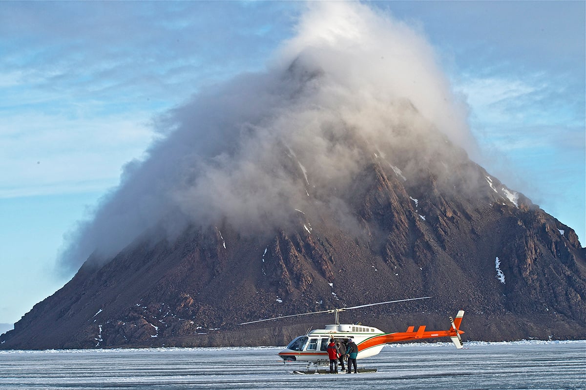 1-Ultimate-Journey-Main-Carousel-Helicopter-in-front-of-mountain-Private-Journey-Arctic-Polar-Adventure-Arctic-Kingdom